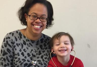 a woman and a child smiling